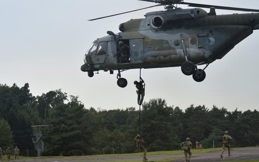 Special operators descend from a Czech MI-171 helicopter during an exercise hosted by the U.S. Special Operations Command Europe at Baumholder, Germany, in 2014. The military’s 2024 budget calls for expenditure of $64 million on various upgrades at Baumholder.