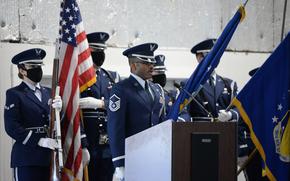 U.S. Air Force Master Sgt. Joshua Lane, Honor Guard noncommissioned officer in charge, 88th Force Support Squadron, sings the National Anthem during the graduation ceremony of 28 new Ceremonial Guardsmen at Wright-Patterson Air Force Base, Ohio, April 20, 2021. Guardsmen demonstrated the six-man flag fold over a casket and 21-gun salute before graduates received their Honor Guard Badges. (U.S. Air Force photo by Ty Greenlees)