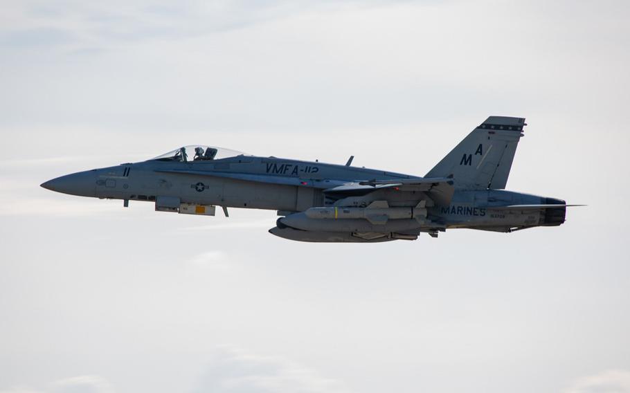 A Marine Corps F/A-18 Hornet equipped with with live, anti-ship Harpoon missiles takes off from Marine Corps Air Station Iwakuni, Japan, Oct. 19, 2021.