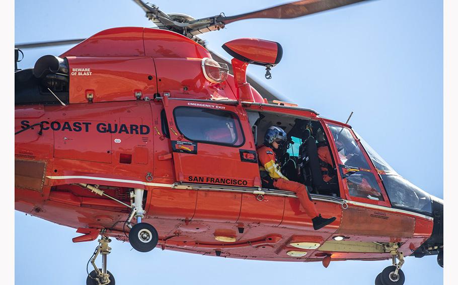 A Coast Guard helicopter crew conducts a search on July 9, 2020, in Lake Piru, Calif.