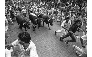 Stars and Stripes
Pamplona, Spain, July, 1989: Revelers attempt to outrace the bulls during the traditional display of bravado on the first day of the San Fermin festival at Pamplona. 