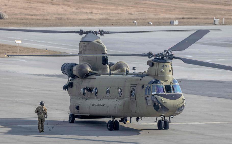 A U.S. Air Force CH-47 Chinook helicopter is seen standing on the tarmac at the airport in Jasionka, near Rzeszow, Poland, on Feb. 16, 2022.
