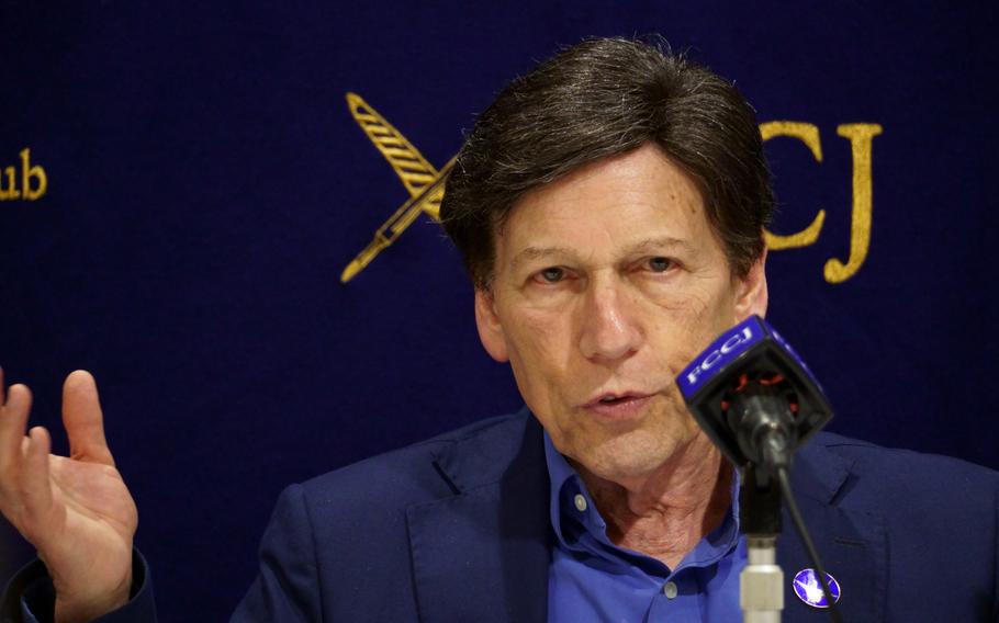 Peter Kuznick speaks to reporters.