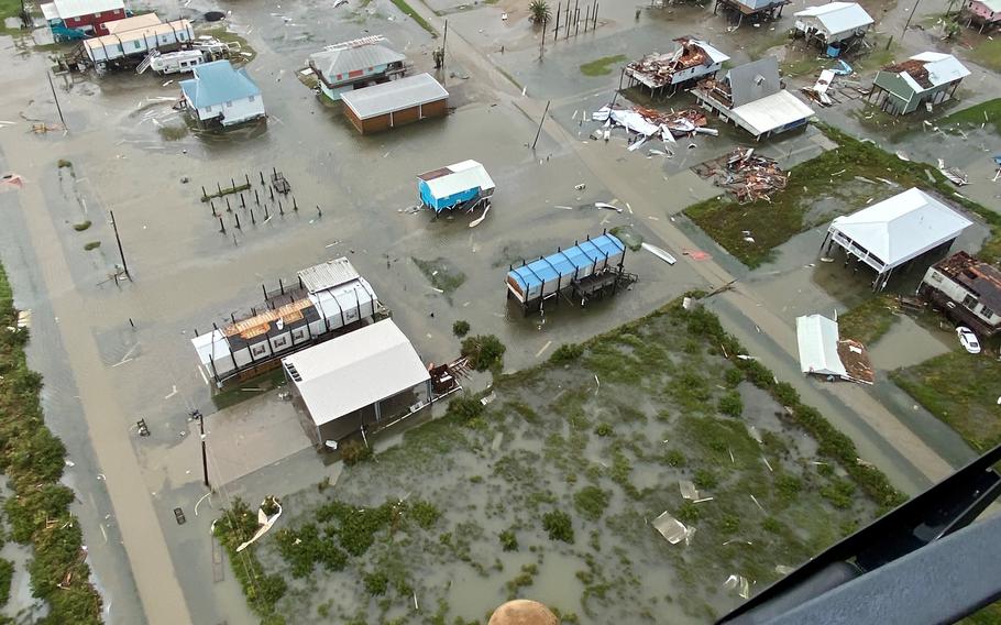 The crew of a UH-72 Lakota helicopter assigned to the Louisiana National Guard’s 2nd Batalltion, 151st Aviation Regiment fly around southeast Louisiana near Grand Isle to look for people in need of rescue following Hurricane Ida, which made landfall Aug. 29. They rescued two people stranded near Lafitte.