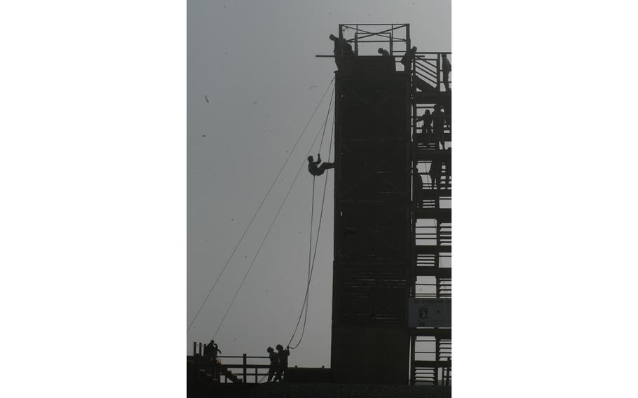 Qayyarah, Iraq, Nov. 28, 2003: Soldiers rappel from a 43-foot tower during training at the 101st Airborne Division’s air assault school at Qayyarah West Air Field in northern Iraq, Nov. 28, 2003.