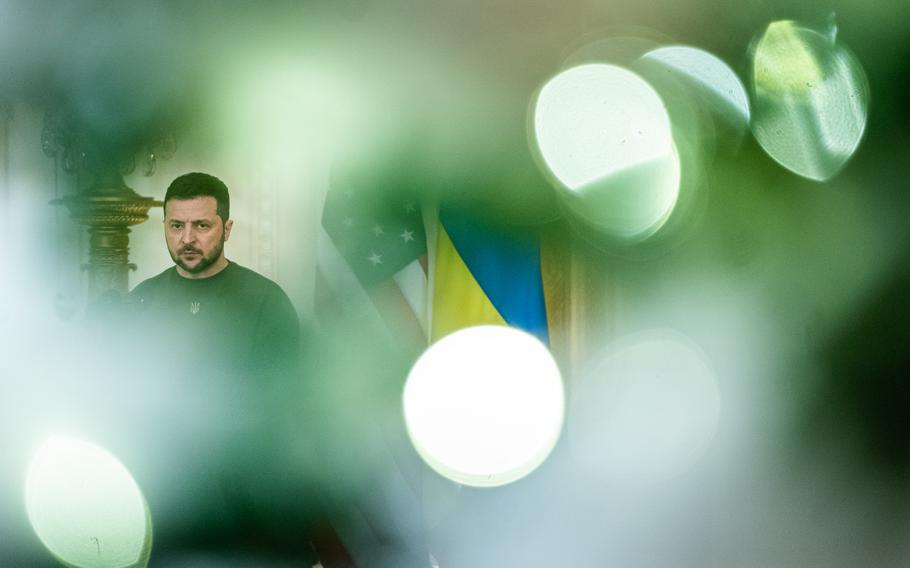 Ukrainian President Volodymyr Zelensky attends a joint news conference at the White House in December. A U.S. official on Wednesday said the decision on when to negotiate a possible end to Russia's invasion is up to Zelensky and the Ukrainian people. 