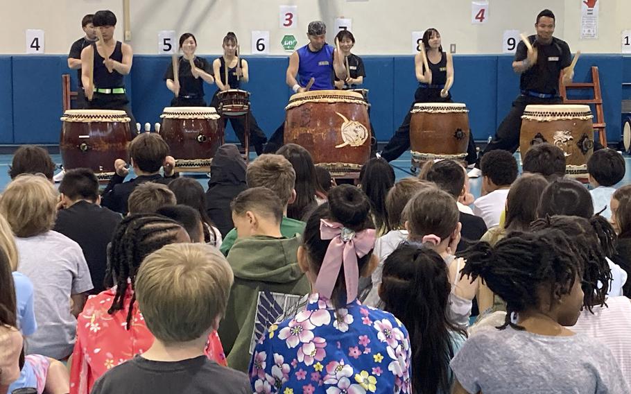 Japanese taiko drummers perform for students during the JaPANDAsia event at Joan K. Mendel Elementary School on Yokota Air Base, Japan, Thursday, May 4, 2023.
