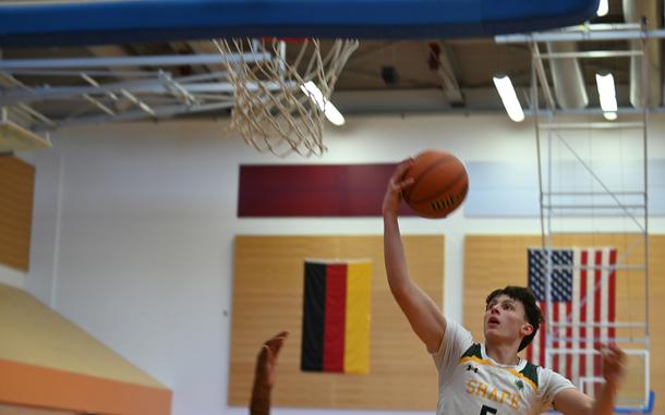 Bela Clobes, a senior from SHAPE High School in Belgium, shoots a layup during the DODEA-Europe Boys Basketball All-Star game at Vilseck High School in Germany on Feb. 24, 2024. (Matthew M. Burke/Stars and Stripes)
