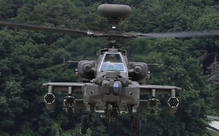 A U.S. Army AH-64E Apache helicopter lands at Camp Humphreys, South Korea, in 2022. Purchases of the attack helicopter by Poland from the U.S. in 2023 amounted to $12 billion, according to the State Department.