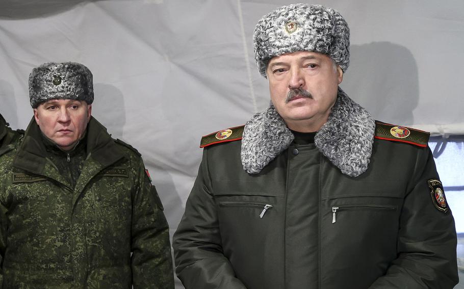 Belarusian President Alexander Lukashenko, right, and Defense Minister Viktor Khrenin attend a meeting with military top officials at the Obuz-Lesnovsky training ground, Belarus, on Jan. 6, 2023. Lukashenko said Monday Feb. 20, 2023 that the ex-Soviet nation will form a new territorial defense force amid the fighting in neighboring Ukraine. 
