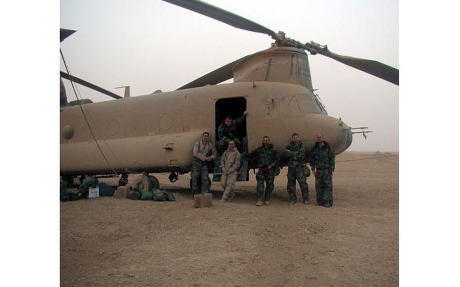 The crew of one of the three stricken Chinook helicopters poses after their safe landing. They are (from left) Sgt. Lance Reynolds, 29, the flight engineer; Staff Sgt. Michael O’Keefe, 33, the door gunner; Chief Warrant Officer 2 Randy Summerlin, 31, the jump-seat pilot; Chief Warrant Officer 3 Dan Helus, 37, the pilot-in-command; Chief Warrant Officer 2 Clay Rekow, 27, the right-seat pilot; and Sgt. Kevin Ellison, 26, the crew chief.