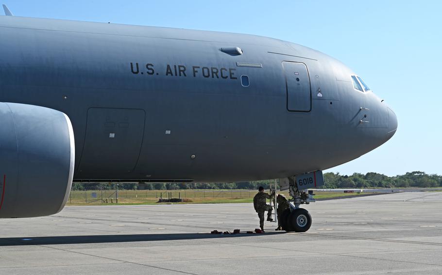 From left, Tech. Sgt. Christian Sadousky and Senior Airman Nate Forster, crew chiefs with the 157th Air Refueling Wing, inspect a KC-46 refueler shortly after landing on Feb. 16, 2024, in El Salvador. 