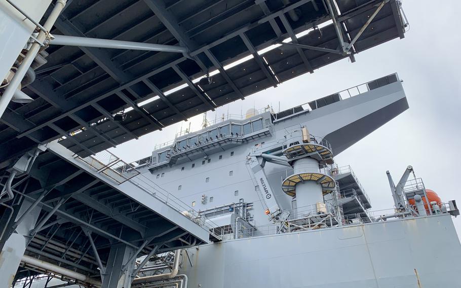 The bridge of USS Hershel "Woody" Williams is visible from this photo taken May 1, 2024, from the ship's 50,000-square-foot mission deck below. The ship is manned by a hybrid crew of 100 Navy sailors who manage flight and other operations, and 50 civilian mariners responsible for navigation and maintenance.