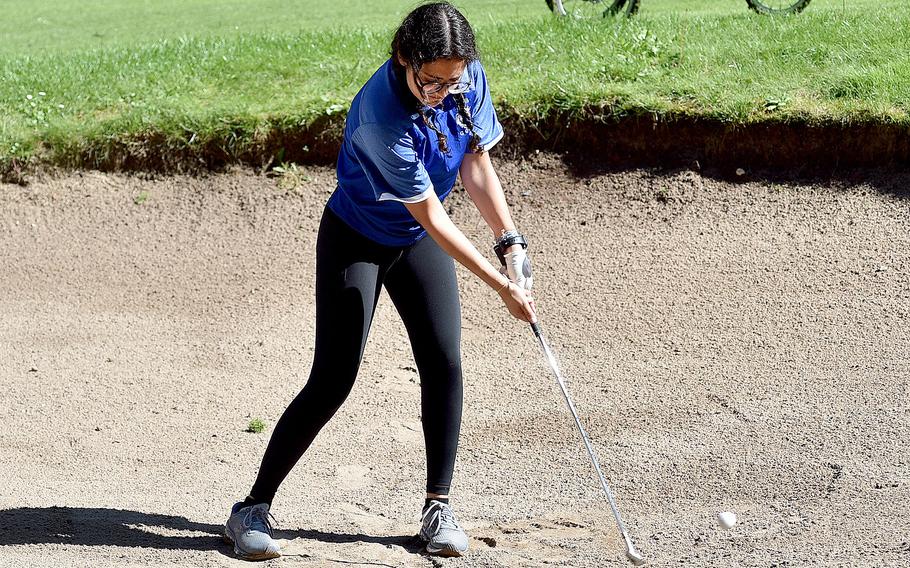 Ramstein's Marina Martin hits out of a sand trap during a travel-team qualifier on Sept. 7, 2023, at Woodlawn Golf Course on Ramstein Air Base, Germany.