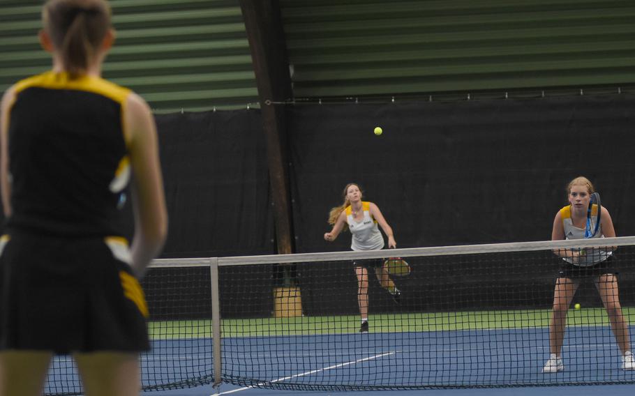 Vicenza’s Annika Svenson hits the ball during doubles play to Stuttgart’s Kiera French at the DODEA European tennis championships on Friday, Oct. 21, 2022, in Wiesbaden, Germany. Svenson and teammate Addie Wilson lost to French and her sister, Devin French, in three sets in the semifinals.