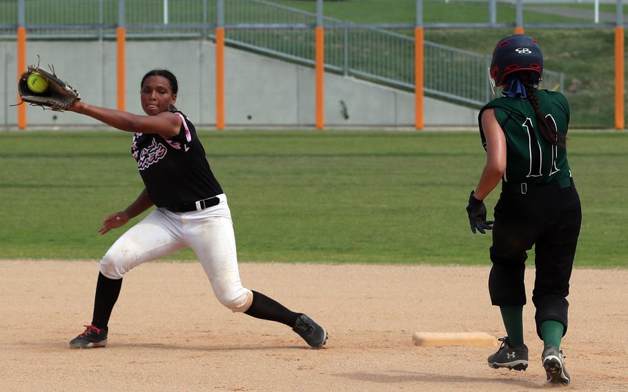 Kadena shortstop Jada Wolfgang takes the throw to try to erase Kubasaki baserunner Isabel Pennington. Wolfgang was named the D1 softball tournament MVP.