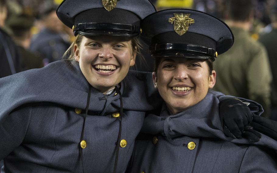 Two Army cadets hug in celebration moments after the Black Knights won the 123rd Army-Navy football game, defeating the Midshipmen 20-17 in double overtime at Philadelphia’s Lincoln Financial Field on Saturday, Dec. 10, 2022.