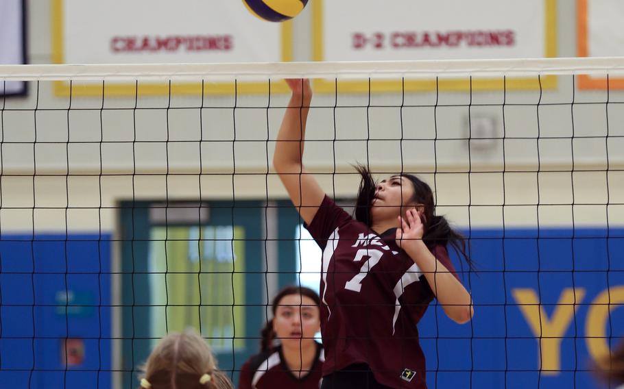 Matthew C. Perry's Raelin Reyes spikes the ball against Zama.
