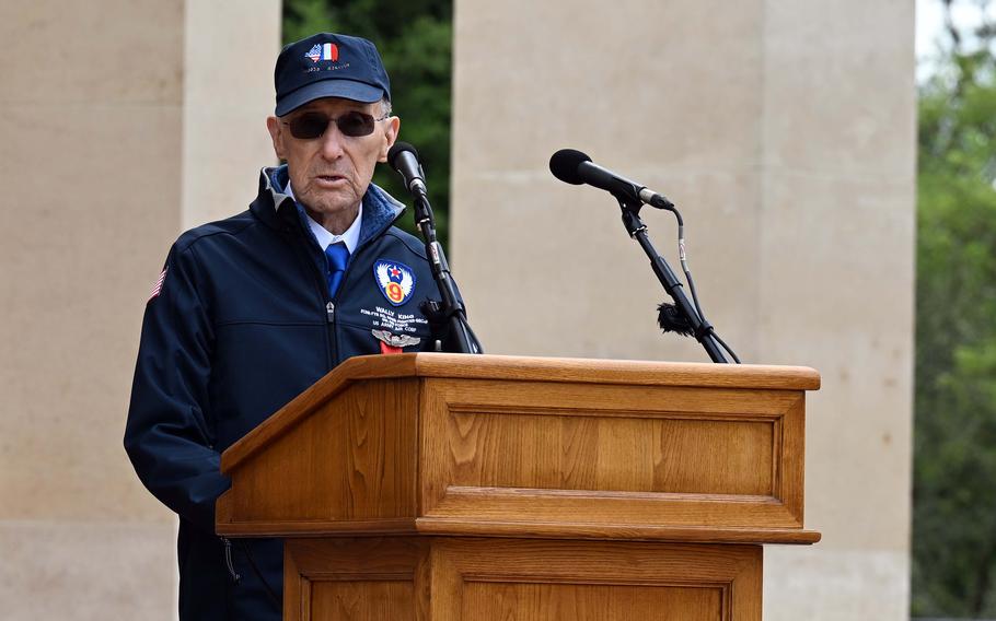 A man speaks at a podium.