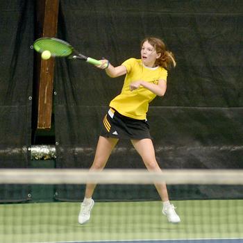 Vicenza’s Delia Gordon hits during her match with Sigonella’s Charlize Caro on Thursday during the DODEA European tennis championships at the T2 Sports Health Club in Wiesbaden, Germany. 