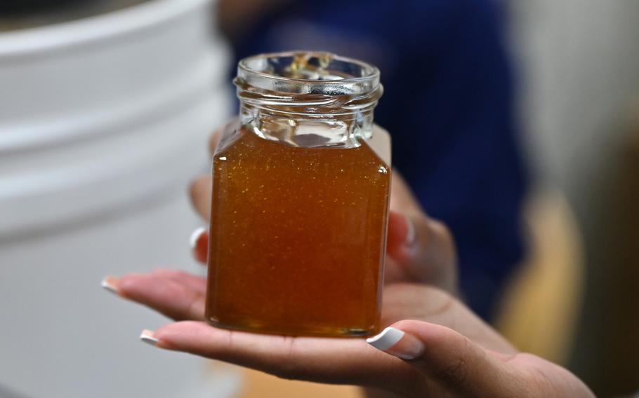 A glass jar of honey. 