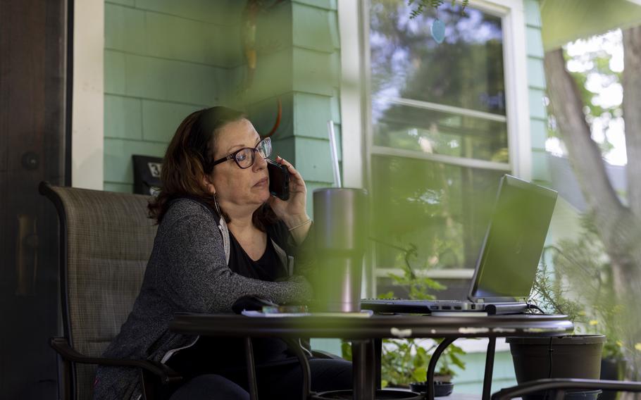 Kim Staffieri at her home in Fairport, N.Y., on June 13, 2022. Staffieri set up a workstation on her front porch, from where she volunteers to help Afghans who assisted the U.S. government during 20 years of war. 