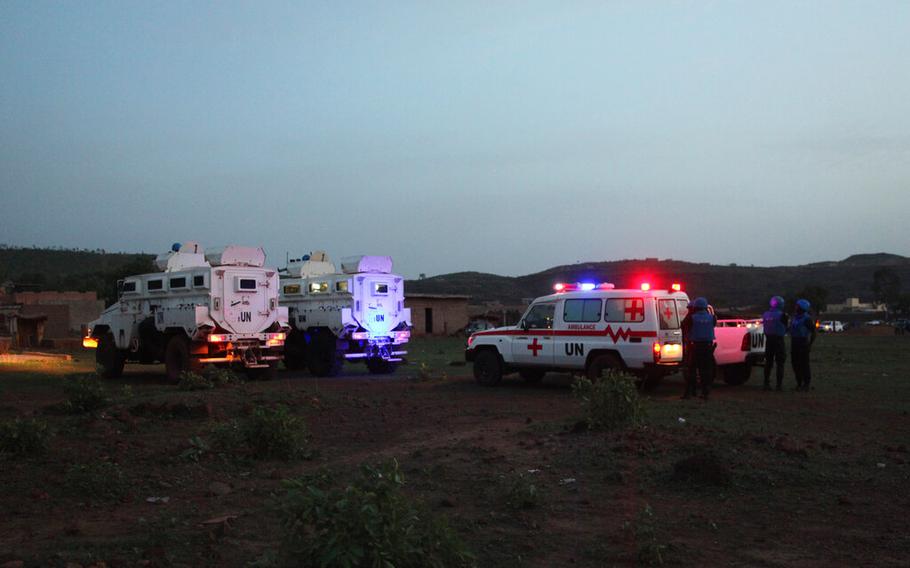 UN armored personnel vehicles are stationed with an ambulance outside a tourist resort near Bamako, Mali, June 18, 2017. 