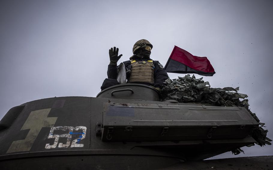 Ukrainian soldiers driving a self-propelled howitzer down a country road on Nov. 18, 2022, in Kherson Region. Russian troops have retreated to the east side of the Dnieper River into more fortified defensive positions, suggesting the war will go on for months. 