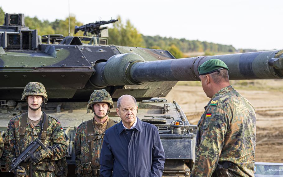 German Chancellor Olaf Scholz talks to German army Bundeswehr soldiers at a “Leopard 2” main battle tank during a training and instruction exercise in in Ostenholz, Germany, Monday, Oct. 17, 2022. Germany has become one of Ukraine’s leading weapons suppliers in the 11 months since Russia’s invasion. The debate among allies about the merits of sending battle tanks to Ukraine has focused the spotlight relentlessly on Germany, whose Leopard 2 tank is used by many other countries and has long been sought by Kyiv. 