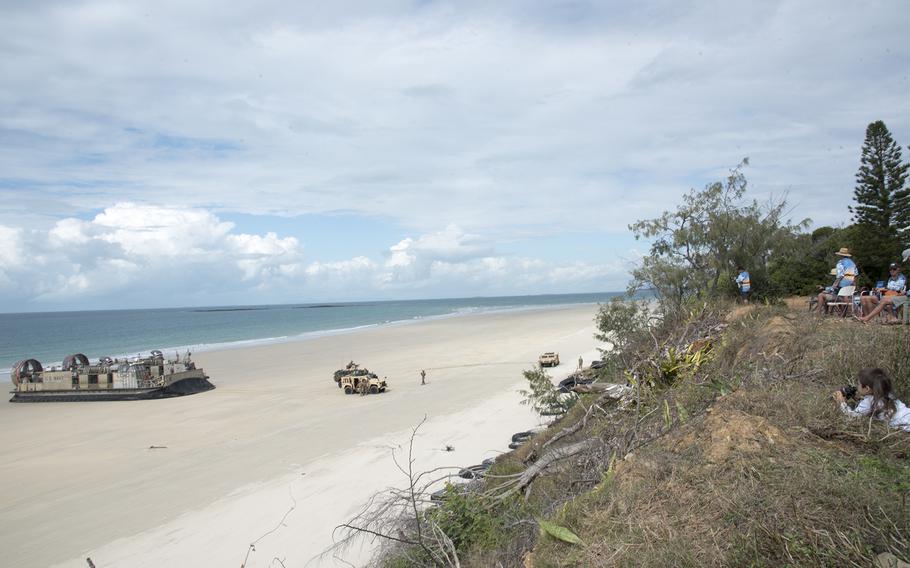 Locals watch an amphibious assault on Langham Beach during Talisman Sabre training near Stanage Bay, Australia, Wednesday, Aug. 2, 2023. 