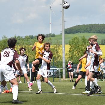 Stuttgart's Itzak Sandoval goes up for a ball over Vilseck's Chase Diaz during pool-play action on May 15, 2023, in Reichenbach-Steegen, Germany.