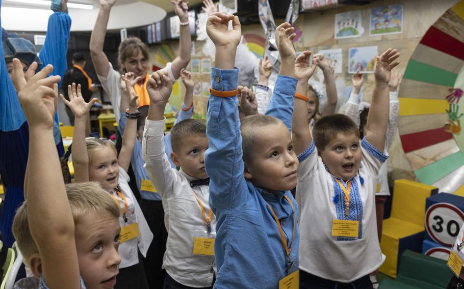 First-grade students during their first day of school held in a newly built classroom in the underground metro station in Kharkiv, Ukraine.