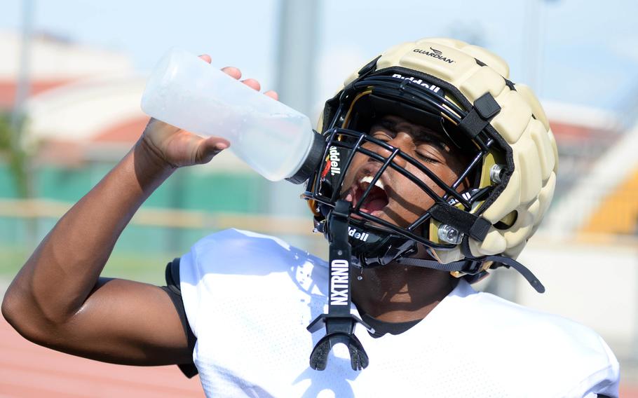 JoJo Brinkerhoff takes a drink.
