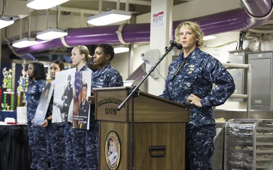 Capt. Amy Bauernschmidt speaks at a Women's History Month function aboard the USS Abraham Lincoln in 2017, when she was the aircraft carrier's executive officer. She later became the ship's commanding officer and this month was nominated for elevation to the rank of one-star admiral.