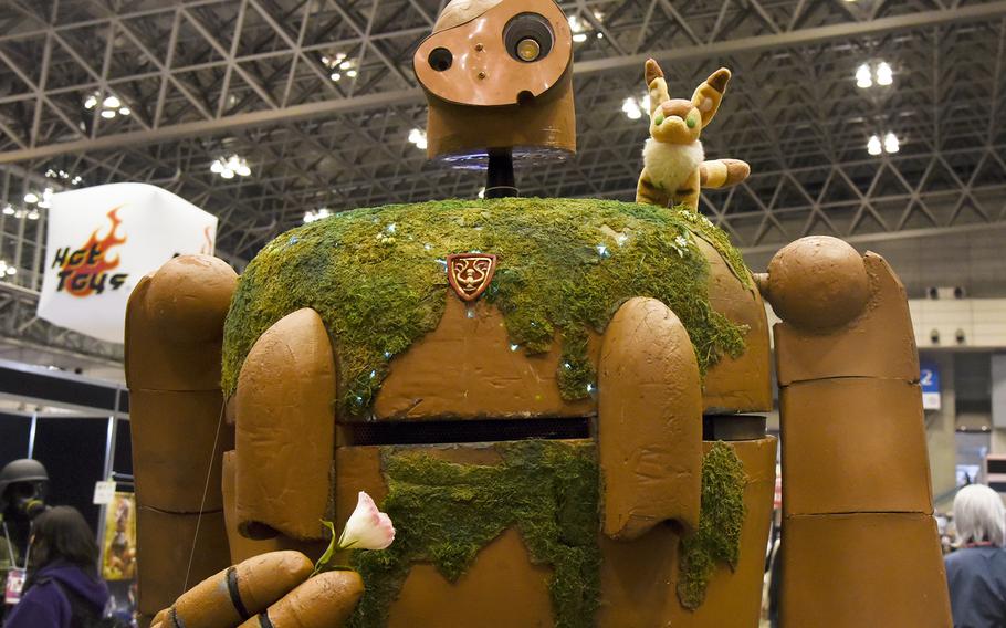 A cosplayer dresses as a Laputian Robot Trooper from the Studio Ghibli film “Laputa: Castle in the Sky” during Tokyo Comic Con at the Makuhari Messe Convention Center in Chiba, east of central Tokyo, Dec. 10, 2023. 