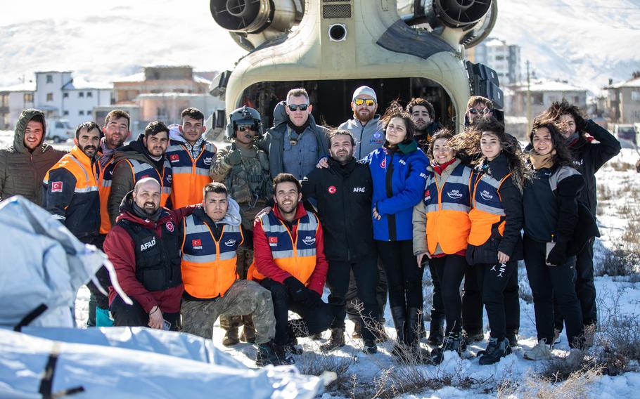 U.S. Army Staff Sgt. Jose Borda takes a group photo with Turkish relief workers in Elbistan, Turkey, on Tuesday, Feb. 14, 2023.