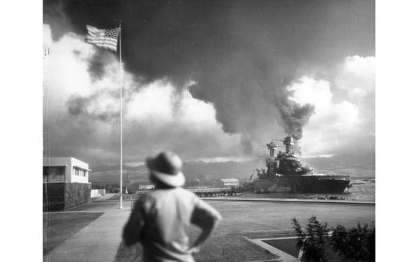 The scene on the southeastern part of Ford Island, looking northeasterly, with USS California (BB-44) right center, listing to port after being hit by Japanese aerial torpedoes and bombs on Dec. 7, 1941, at Pearl Harbor. 