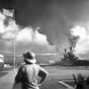 The scene on the southeastern part of Ford Island, looking northeasterly, with USS California (BB-44) right center, listing to port after being hit by Japanese aerial torpedoes and bombs on Dec. 7, 1941, at Pearl Harbor. 