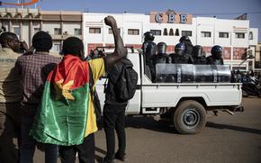 Protestors take to the streets of Burkina Faso's capital Ouagadougou Saturday Jan. 22, 2022, 27, 2021, protesting the government's inability to stop jihadist attacks spreading across the country and calling for President Roch Marc Christian Kabore to resign. (AP Photo/Sophie Garcia)