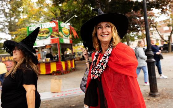 Witch enthusiasts Mellissa Campo, left, and Tammie Cash visit Salem, Mass., from Rhode Island. Last October, Salem welcomed more than 900,000 tourists — about 20 times the city’s population, according to a U.S. Census estimate. 