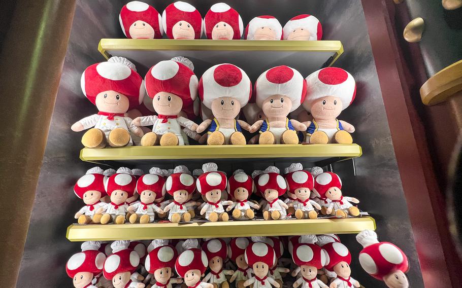 Toad plushes for sale inside the 1UP Factory at Super Nintendo World in Universal Studios Japan. 