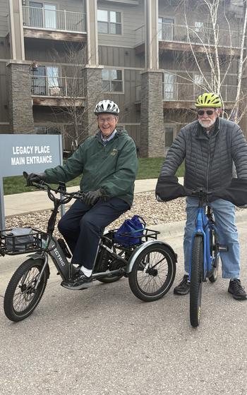 Two men on electric bicycles