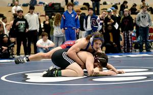 Ramstein's Evan Brooks and Vilseck's Isaac Lane grapple in the first-place match in the 215-pound weight class on Saturday at Ramstein High School on Ramstein Air Base, Germany.