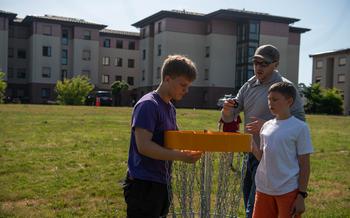 Boy Scouts install a disc golf basket