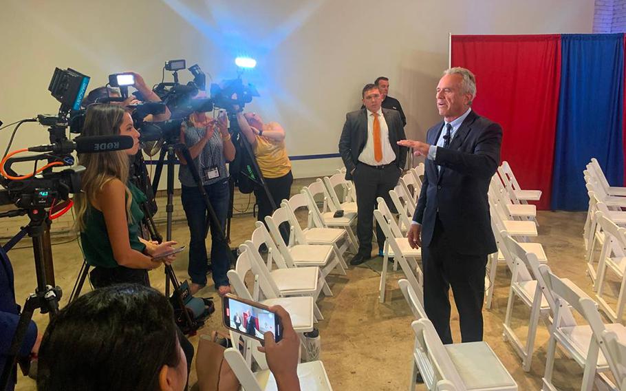 Democratic presidential candidate Robert Kennedy Jr. speaks to reporters before a town hall event in Greenville, S.C. Aug. 21, 2023.