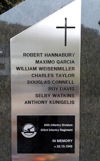 A plaque shows the names of eight soldiers who died in a 1945 crash in Luxembourg.