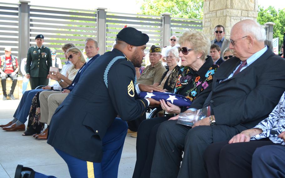 Dianne Mangum accepts a flag to honor her uncle Pvt. Myron Elton Williams at Central Texas State Veterans Cemetery in Killeen, Texas, on June 2, 2023. Williams died in November 1944 during the Battle of Hurtgen Forest in Germany during World War II, but his remains were only identified July 13, 2022. 