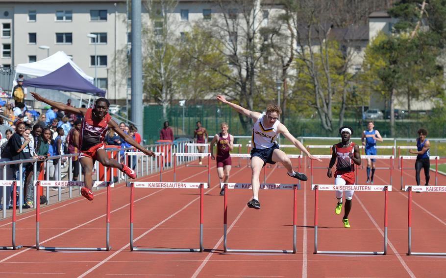 Jeremiah Tran, front right, goes head to head with Kaiserslautern Raider Thomas Jerrell during the 300-meter hurdle event at the Kaiserslautern Track and Field Invitational on Saturday, April 16, 2022, in Kaiserslautern, Germany. Jerrell narrowly won the event with 44.30 seconds, against Tran’s 44.51 seconds. 