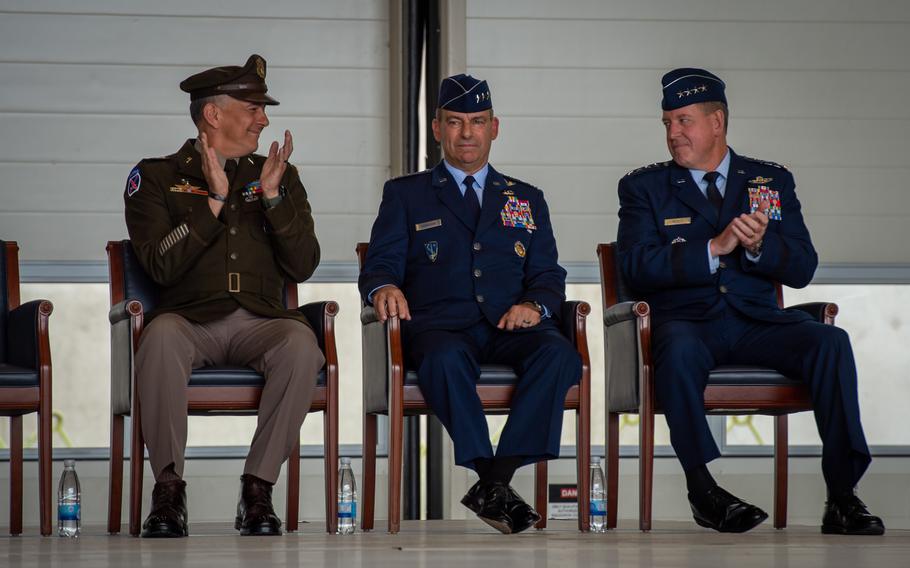Army Gen. Stephen Townsend, head of U.S. Africa Command, left, and Air Force Gen. James B. Hecker, right, applaud outgoing U.S. Air Forces in Europe Air Forces Africa Commander Gen. Jeffrey L Harrigian during a change of command ceremony June 27, 2022, at Ramstein Air Base, Germany. Harrigian relinquished command of U.S. Air Forces in Europe and Air Forces Africa and NATO Allied Air Command and is scheduled to retire after nearly 37 years of active duty service.