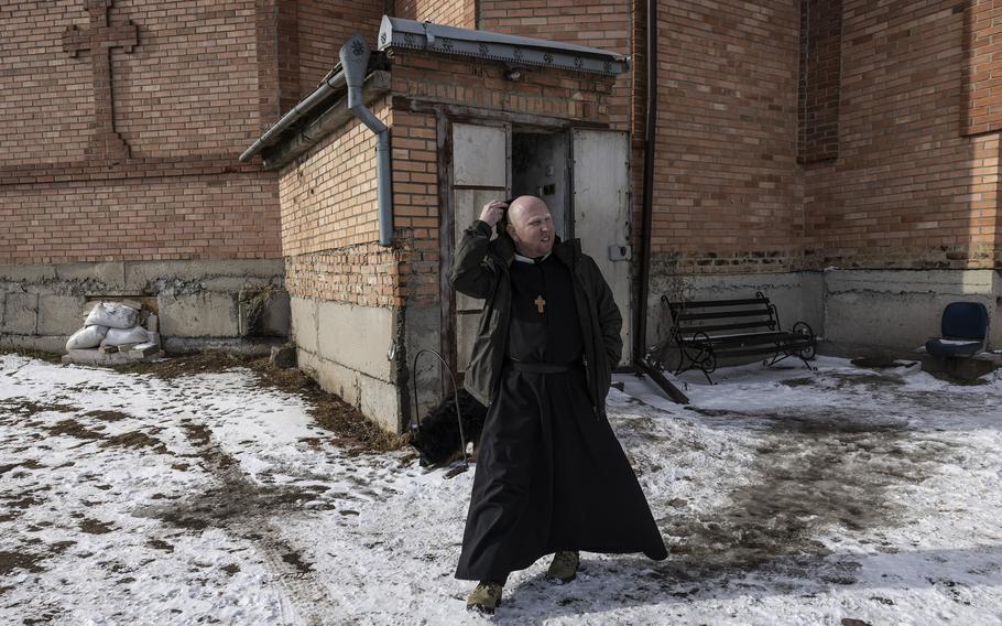 Marko Fedak, a priest, outside his church in his village of Zvanivka, Ukraine, on Feb. 12, 2023. He is preparing to leave for a safer area.